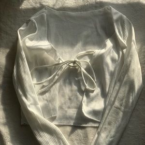 white tie-up top or cropped cardigan